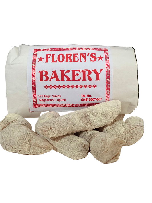 Roll of dough with 'Floren's Bakery' label on a white surface